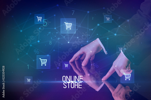 Online shopping with ONLINE STORE inscription concept, with shopping cart icons