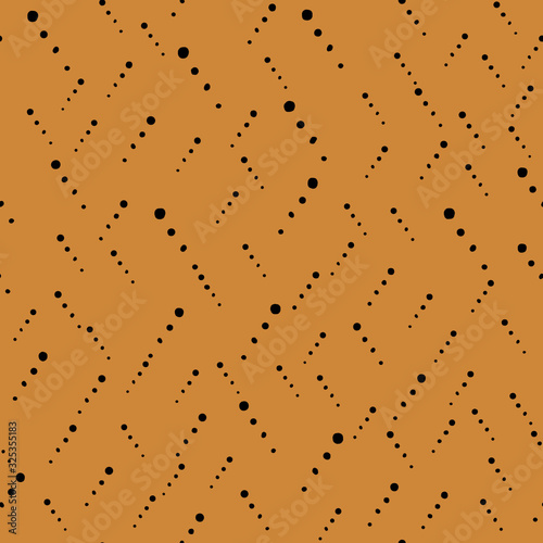 Seamless black geometric patterns on mustard color background. Curved jagged circles, spots, dots form a cluster of zigzag lines. For wallpaper, textile, packaging, banner, fabric, print, poster