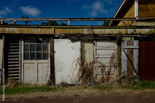 Old slats and doors on side of vintage barn warehouse © WeekendCobra