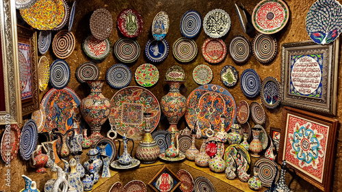 Hittite wine vessels, colorful ceramic vases and porcelain bowls in a underground cave atelier in Avanos in Cappadocia. Turkish traditional ceramic handycrafts in a local pottery shop in Cappadocia