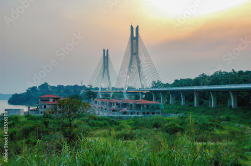Bridge of Corniche in haze at sunset in Brazzaville at 2018. photo