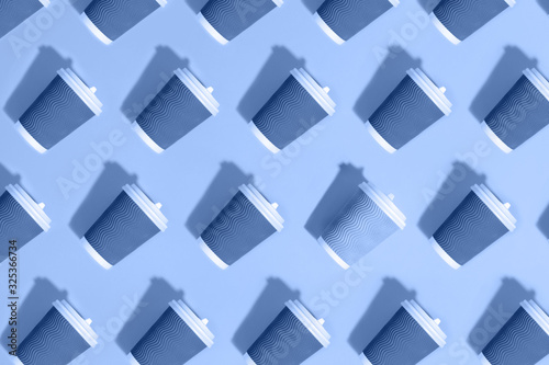 Pattern of paper cups on pink background.