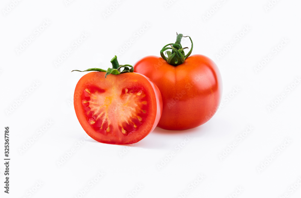 One whole red fresh tomato and half isolated on white background as package design element One whole red fresh tomato and half isolated on white background as package design element