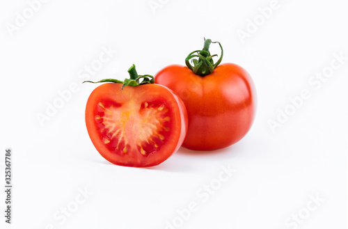 One whole red fresh tomato and half isolated on white background as package design element