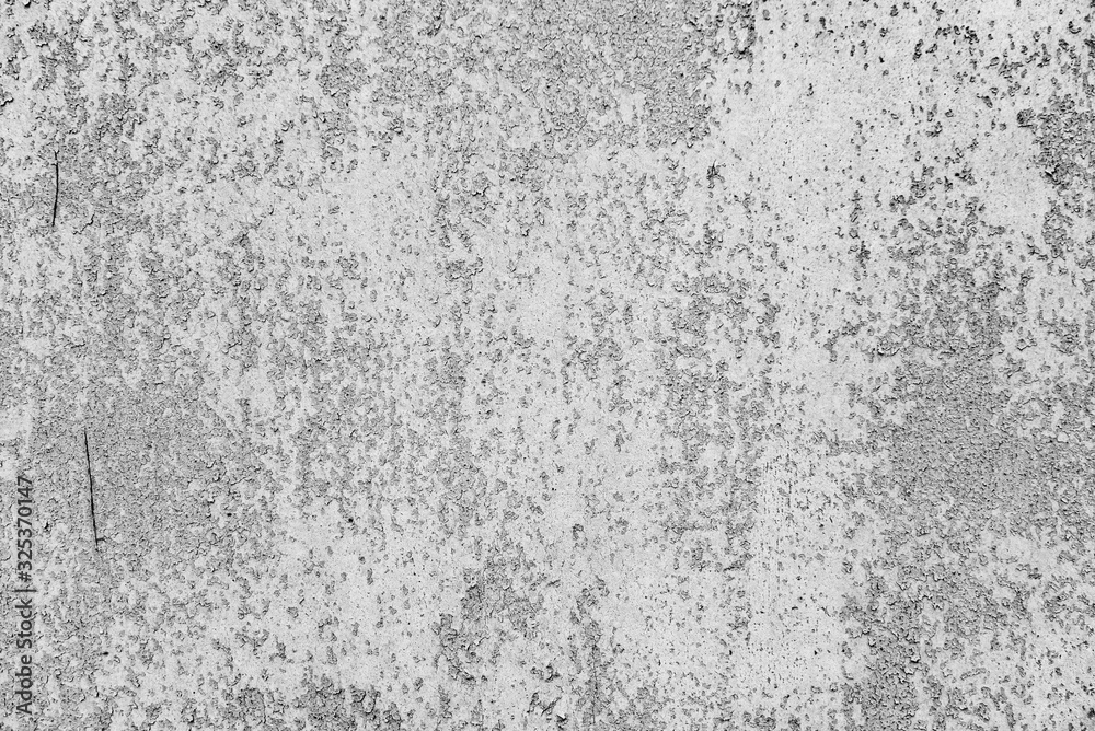 Texture of a metal wall with cracks and scratches which can be used as a background Texture of a metal wall with cracks and scratches which can be used as a background