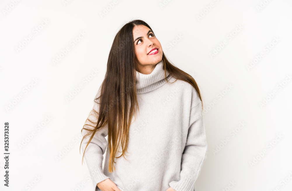 Young caucasian woman isolated on a white background dreaming of achieving goals and purposes Young caucasian woman isolated on a white background dreaming of achieving goals and purposes