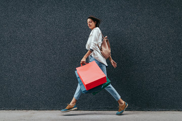 Portrait of excited happy beautiful shopping woman outdoor