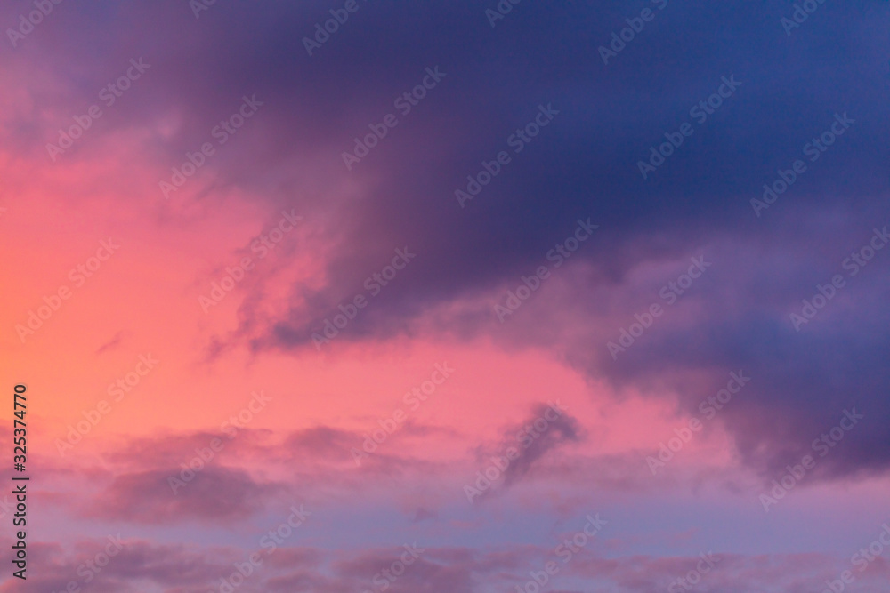 Fototapeta premium Pink dawn in the sky with clouds