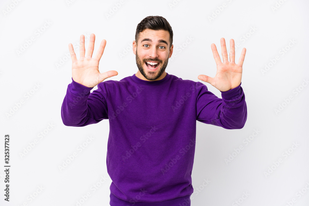 Young caucasian man against a white background isolated showing number ten with hands. Young caucasian man against a white background isolated showing number ten with hands.
