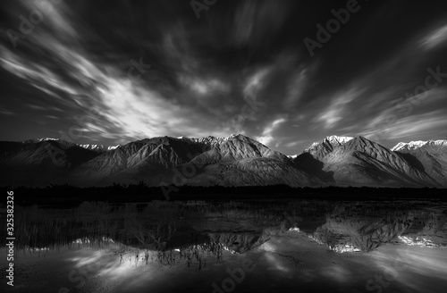 Canvas Print Serene view of Himalayan mountain range reflection in black and white