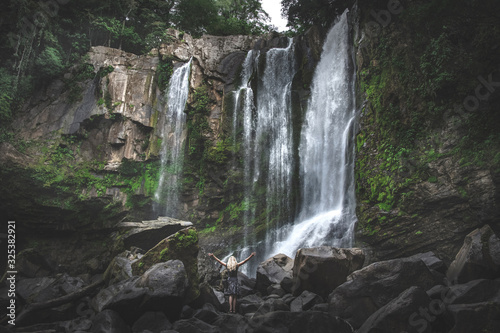 Fototapeta Naklejka Na Ścianę i Meble -  Sexy female model around waterfalls of Costa Rica