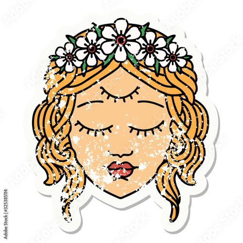 traditional distressed sticker tattoo of female face with third eye