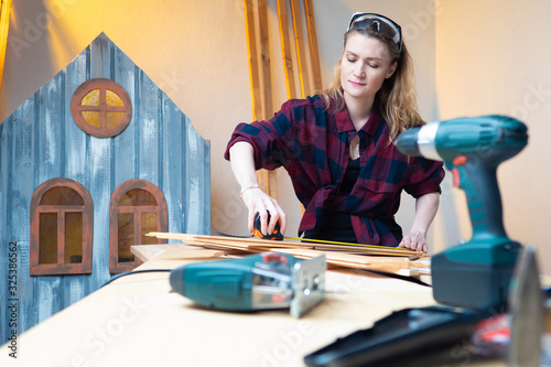 Joinery. A girl in a plaid ...