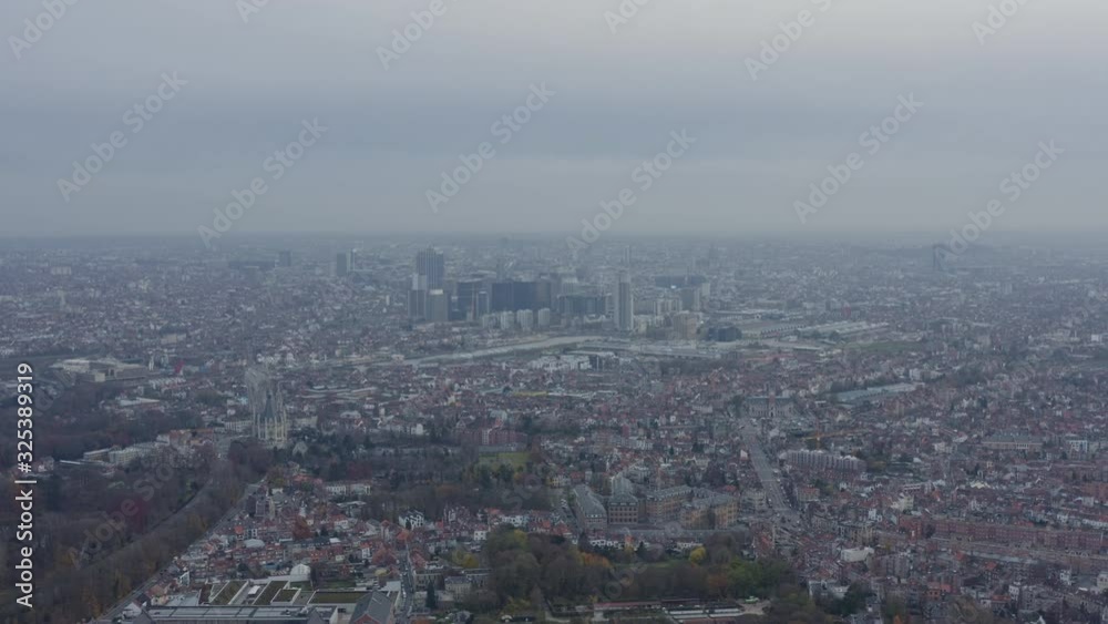 Brussels Belgium Aerial v23 Flying backwards over Stuyvenberg park with full downtown cityscape views - December 2019 Brussels Belgium Aerial v23 Flying backwards over Stuyvenberg park with full downtown cityscape views - December 2019