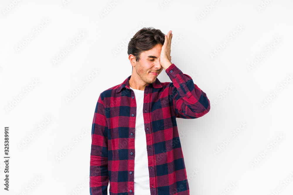 Young caucasian man posing in a pink background isolated forgetting something, slapping forehead with palm and closing eyes. Young caucasian man posing in a pink background isolated forgetting something, slapping forehead with palm and closing eyes.