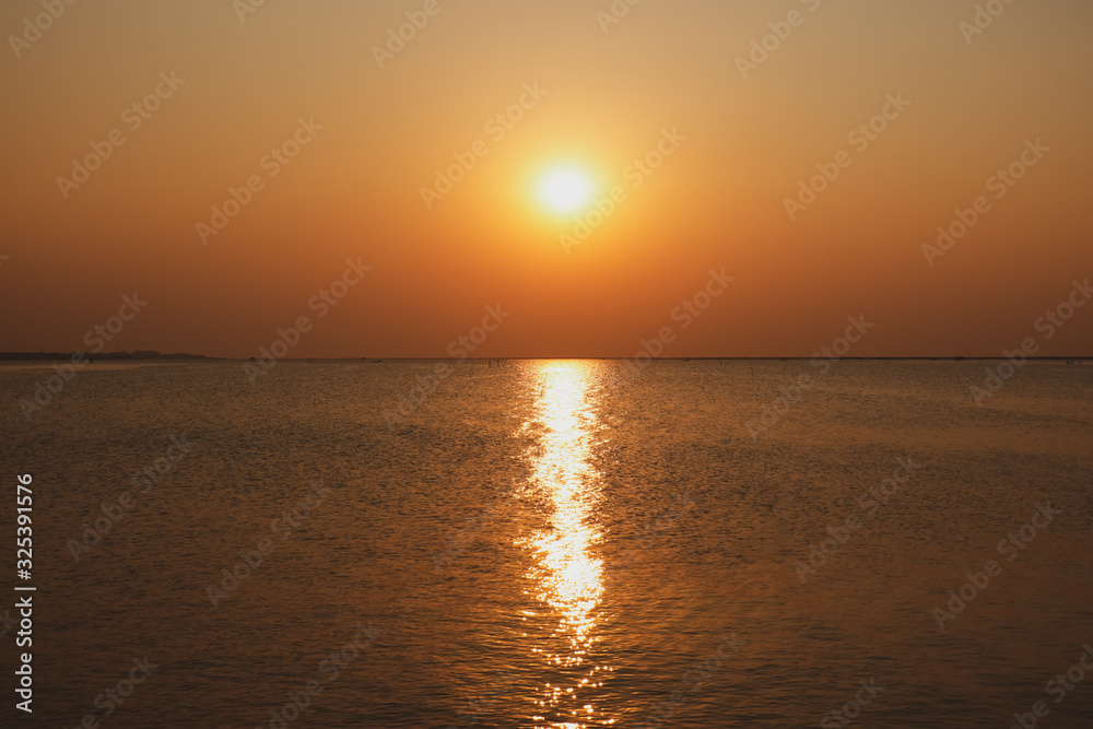 The sunset on the sea in the summer