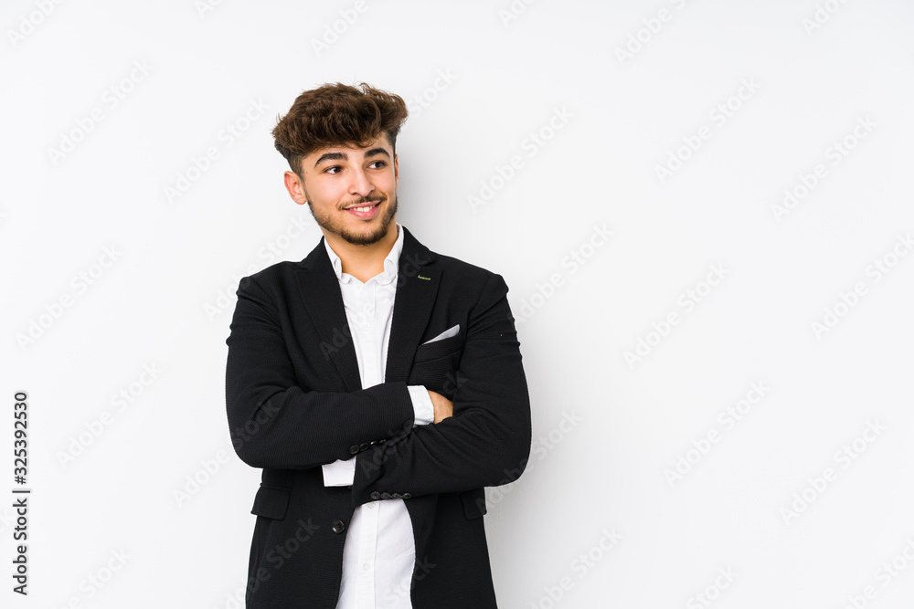 Young arabian business man isolated smiling confident with crossed arms. Young arabian business man isolated smiling confident with crossed arms.