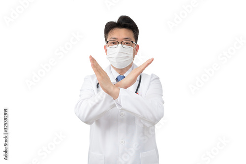 A middle-aged Asian doctor raises his hand and expresses his disapproval