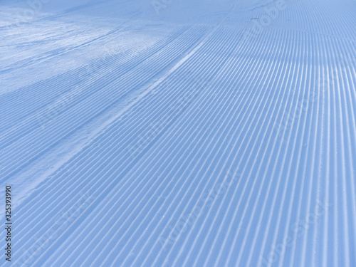 Wallpaper Mural Snowcat tracks in the snow. The stripes form an amazing snowy texture. Theme of relaxation in a ski resort Torontodigital.ca
