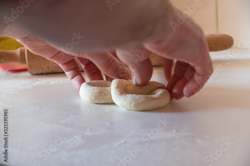 homemade pretzel preparation on white table