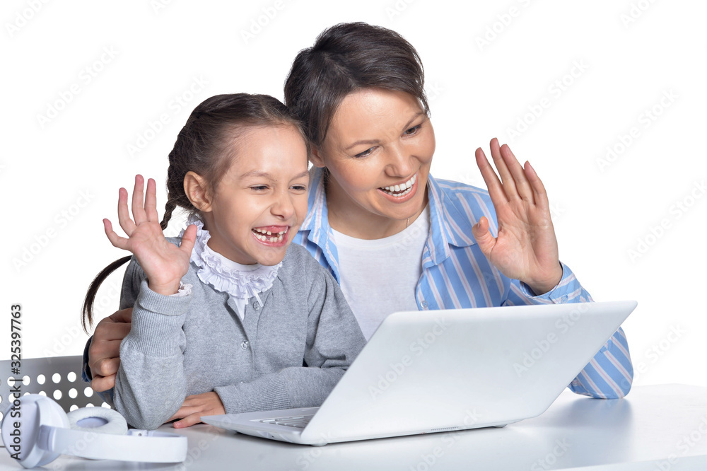Portrait of emotional mother and daughter using laptop Portrait of emotional mother and daughter using laptop