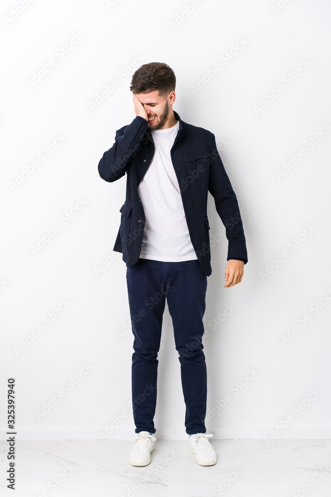 Full body young caucasian man isolated forgetting something, slapping forehead with palm and closing eyes. Full body young caucasian man isolated forgetting something, slapping forehead with palm and closing eyes.