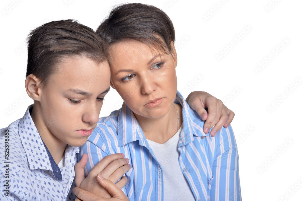 Portrait of sad family posing on white background