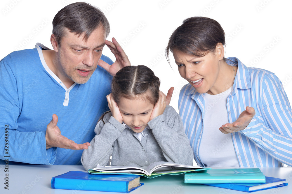 Angry parents screaming on daughter who doing homework Angry parents screaming on daughter who doing homework