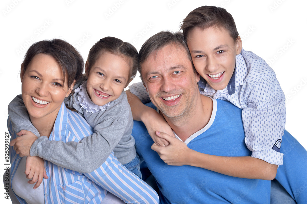 Close up portrait of happy smiling family posing together Close up portrait of happy smiling family posing together