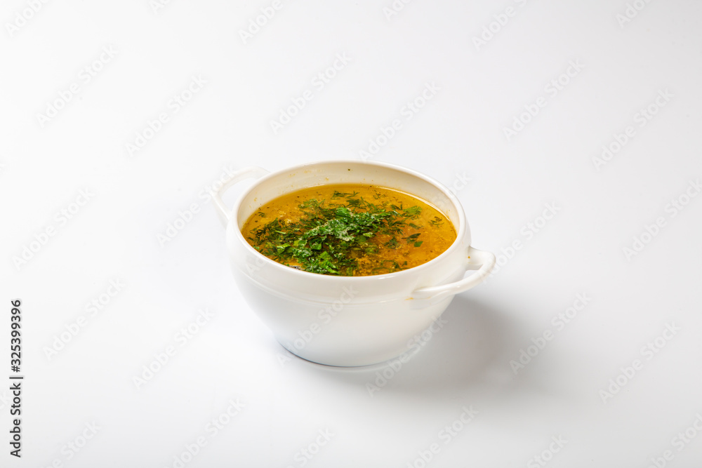 soup of sturgeon. Ear in a white high plate with two handles. Top with parsley soup of sturgeon. Ear in a white high plate with two handles. Top with parsley