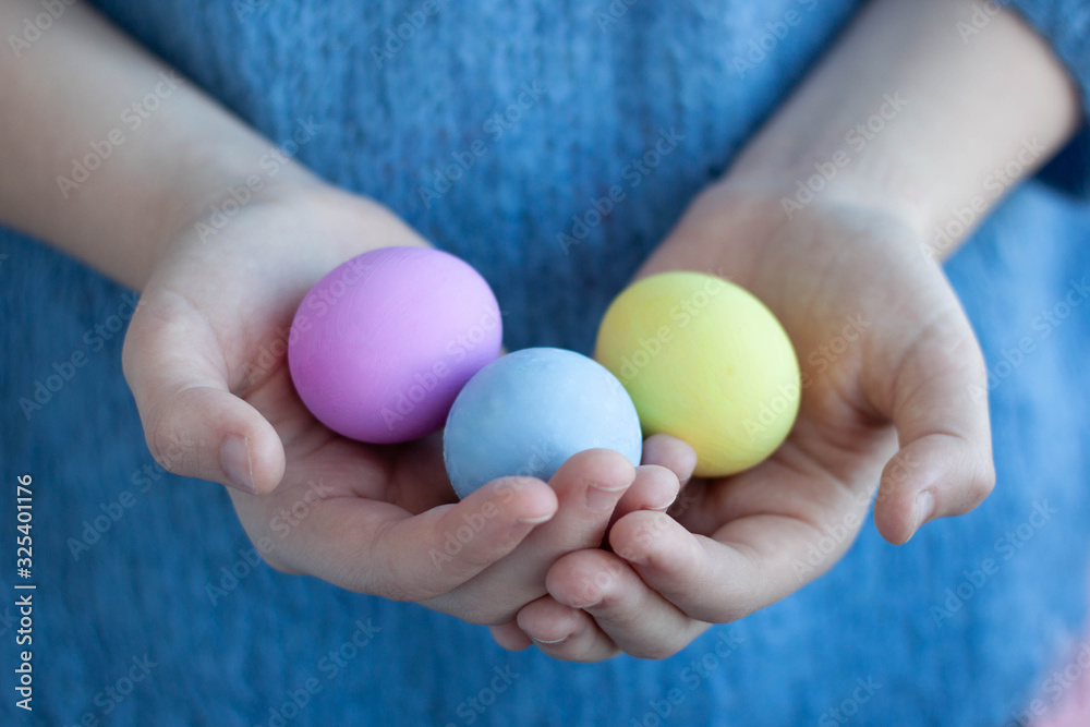 Hands are shaking three eggs painted for the Easter holiday selective focus Hands are shaking three eggs painted for the Easter holiday selective focus