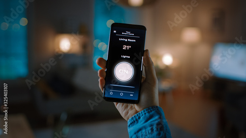 Tableau sur toile Close Up Shot of a Smartphone with Active Smart Home Application
