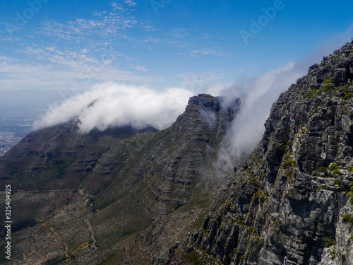 The plateau of Table Mountain in Cape Town is covered in clouds
