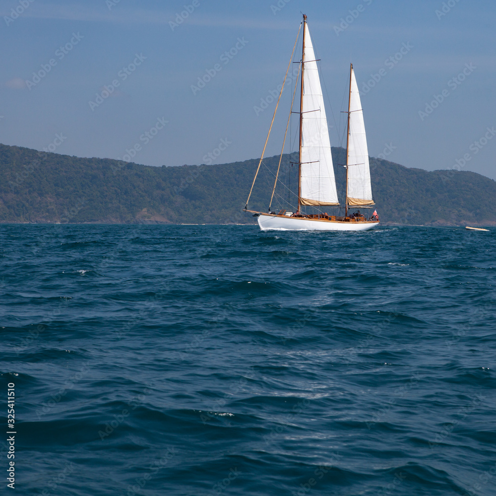 Fototapeta premium Landscape of tropical island with moving boat.