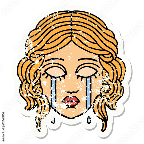 traditional distressed sticker tattoo of female face crying