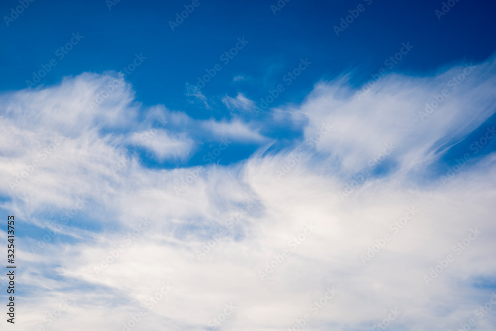 White clouds against the blue sky. White clouds against the blue sky.