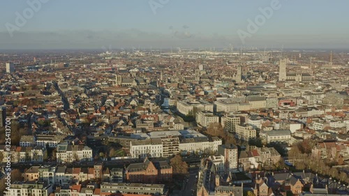 Ghent Belgium Aerial v5 Flying over neighborhood town down into Leie canal area with downtown cityscape views - November 2019 photo