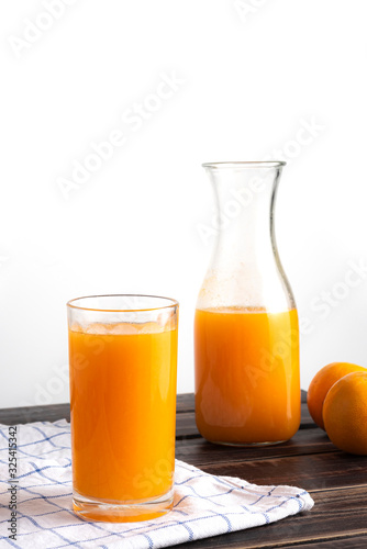 fresh squeezed orange juice on wood table