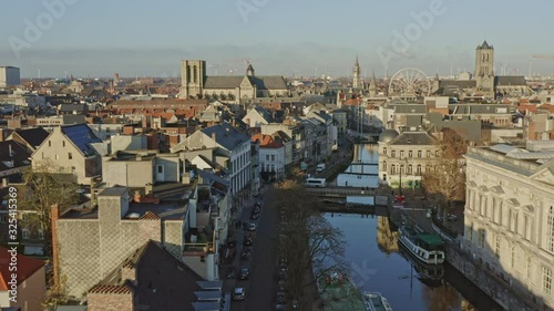 Ghent Belgium Aerial v6 Flying low over Leie canal neighborhood into downtown with cityscape views - November 2019 photo
