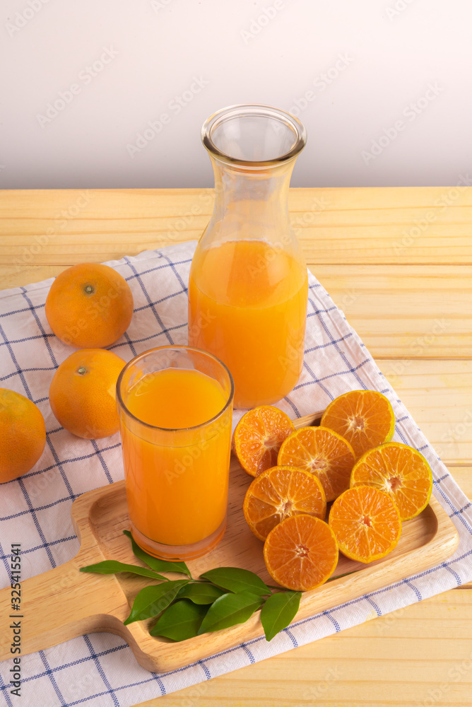 fresh squeezed orange juice on wood table fresh squeezed orange juice on wood table