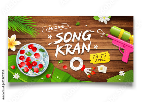 Songkran festival thailand bowl and gun water, flower on wood background design, vector illustration