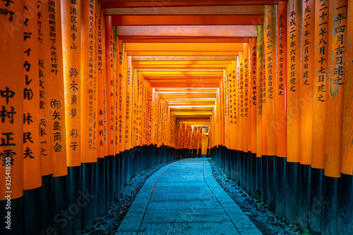 Japan. Kyoto. Torii Of Fushimi Inari Shrine. Fushimi Inari Taisha Temple. Religious complex on mount Inariyama. The temple of the thousand gates. The orange gates seem endless. Religion Of Japan. photo