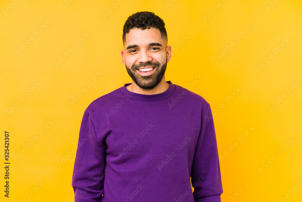 Young mixed race arabic man isolated happy, smiling and cheerful. Young mixed race arabic man isolated happy, smiling and cheerful.