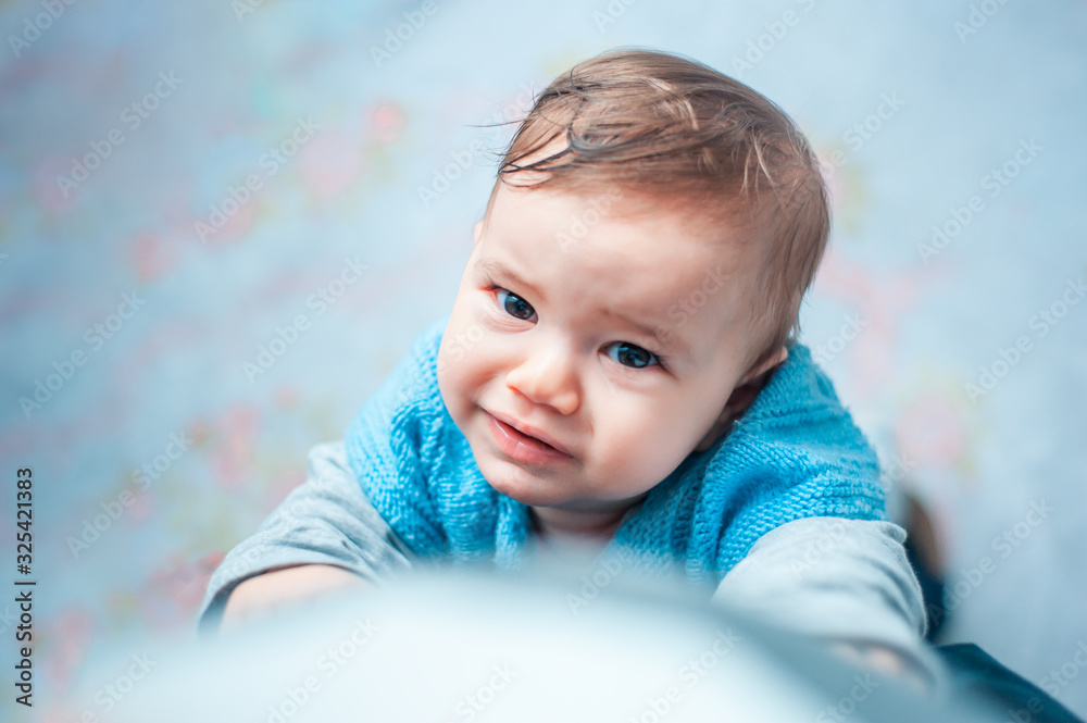 Toddler looking up with pleading eyes and wants to be embraced Toddler looking up with pleading eyes and wants to be embraced