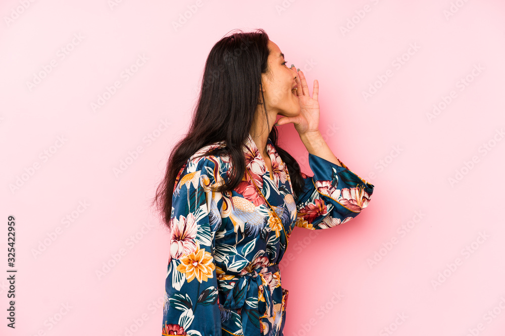 Young chinese woman wearing a asiatic pijama isolated cheerful and confident showing ok gesture. Young chinese woman wearing a asiatic pijama isolated cheerful and confident showing ok gesture.