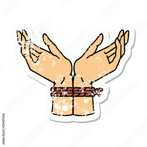 traditional distressed sticker tattoo of a pair of tied hands