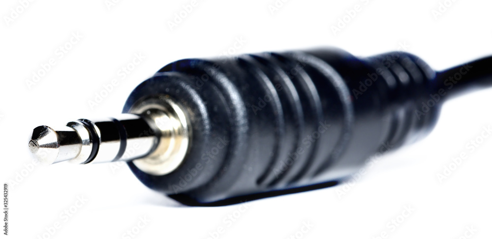 Close-up of 3.5mm jack connector isolated on white background. Close-up of 3.5mm jack connector isolated on white background.