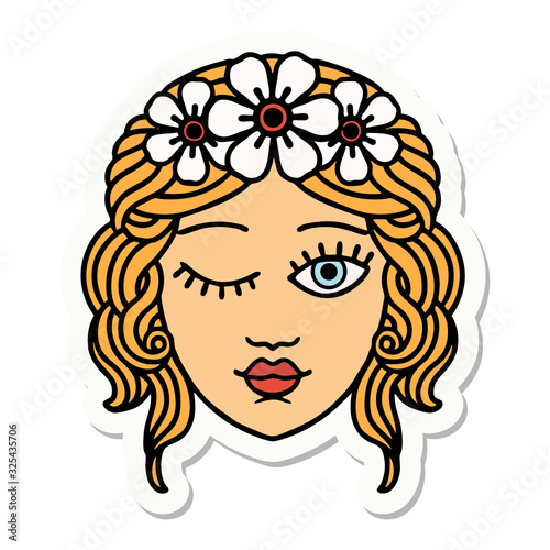 tattoo style sticker of a maidens face winking