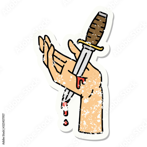 traditional distressed sticker tattoo of a dagger in the hand