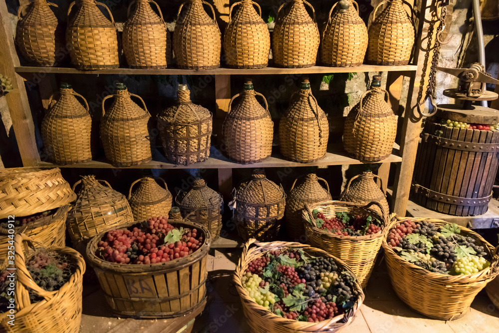 Old cellar with barrels of wine.